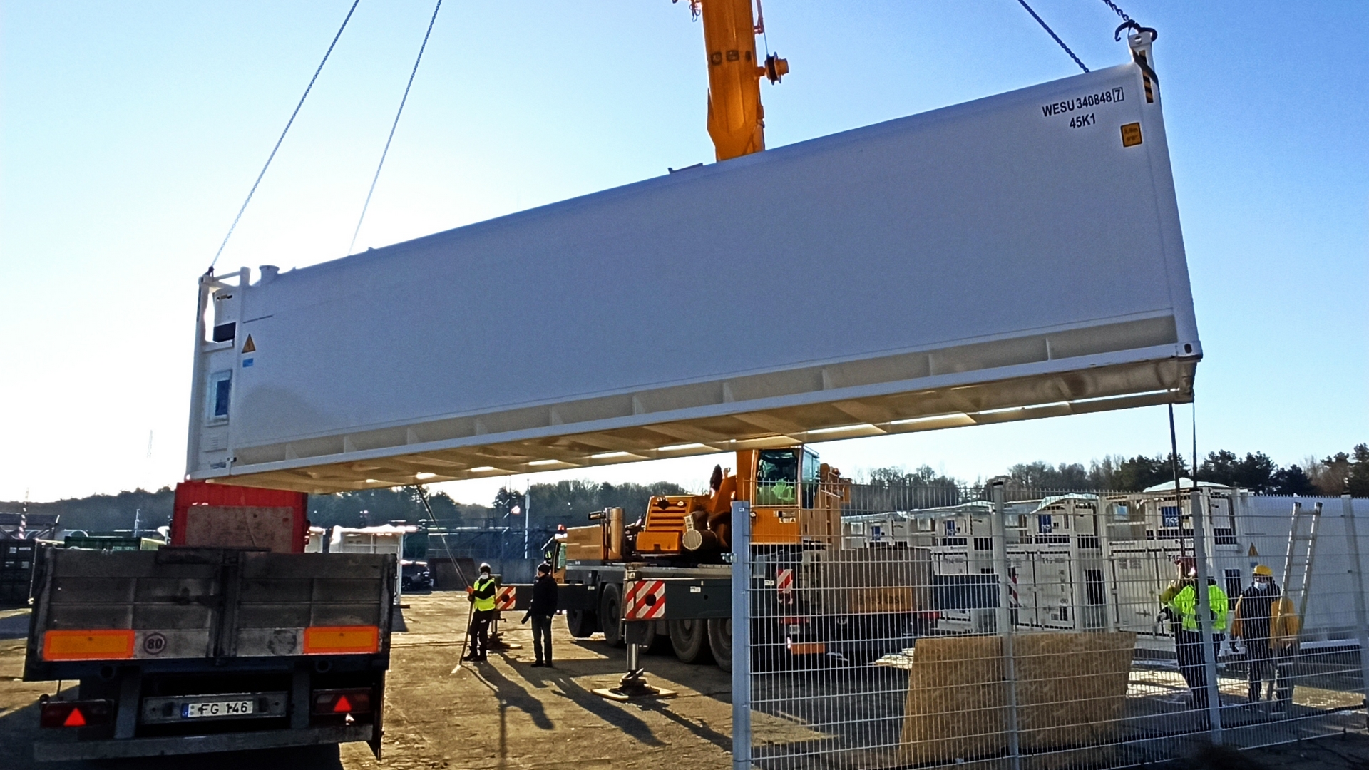 Three trucks parked next to each other
